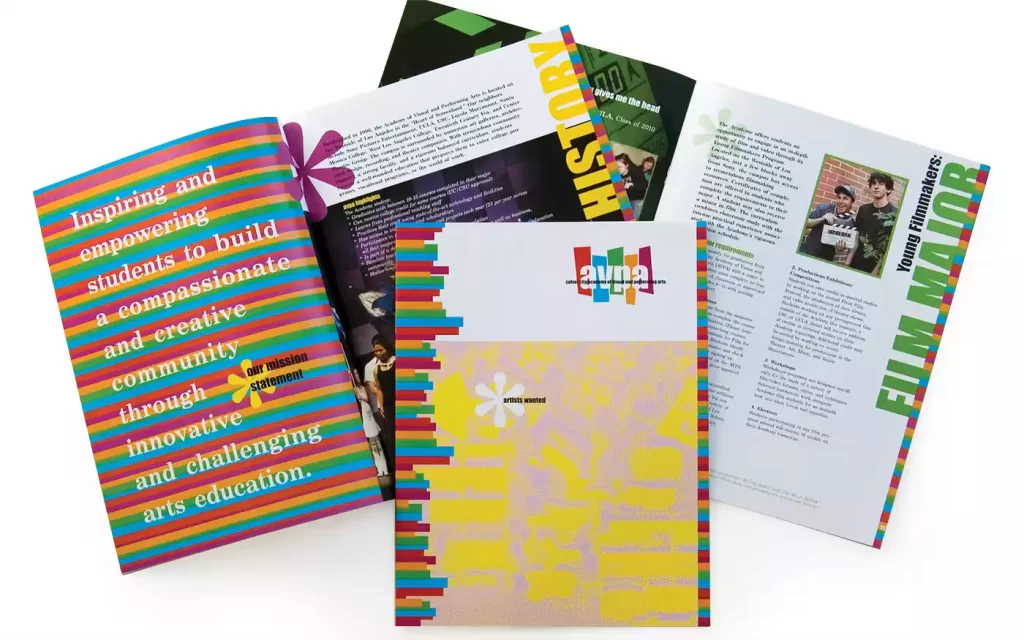 3 copies of a colorful brochure mane to advertise the school. Two are open to different pages and one is closed so the cover is visible.